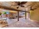 Expansive patio area featuring a stone fireplace, outdoor grill, and plenty of space for seating and dining at 125 E Loma Ln, Phoenix, AZ 85020