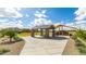 Community park featuring a covered picnic area, playground, walkway, landscaping, and a clear blue sky at 14323 W Alameda Rd, Surprise, AZ 85387