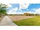 Community volleyball court with sand and new home construction in background at 14323 W Alameda Rd, Surprise, AZ 85387