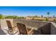 This inviting balcony offers comfortable rocking chairs with mountain views and lush foliage at 1451 E South Fork Dr, Phoenix, AZ 85048