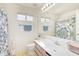 Bathroom with a single sink vanity, overhead lighting, and an alcove shower at 1451 E South Fork Dr, Phoenix, AZ 85048