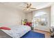 Cozy bedroom with a large window and an accent chair at 1451 E South Fork Dr, Phoenix, AZ 85048