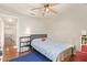 Cozy bedroom features a book shelf and a ceiling fan at 1451 E South Fork Dr, Phoenix, AZ 85048