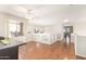 The brightly lit living area features wood floors and large windows at 1451 E South Fork Dr, Phoenix, AZ 85048