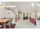 Open-concept living area with high ceilings and a staircase with landing at 1451 E South Fork Dr, Phoenix, AZ 85048