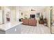 Spacious living room with a fireplace and plenty of natural light and tile floors at 1451 E South Fork Dr, Phoenix, AZ 85048
