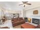 Open-concept living room flows into the kitchen with stainless appliances and modern gray cabinets at 1451 E South Fork Dr, Phoenix, AZ 85048