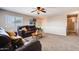 Cozy upstairs living room with a dark brown leather sofa and neutral carpet at 1585 E Jeanne Ln, San Tan Valley, AZ 85140