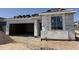 Under construction home with garage, window and partially installed roof at 18224 W La Senda Dr, Surprise, AZ 85387