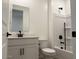 White bathroom with a tub/shower combo, modern vanity, and updated fixtures at 18240 W La Senda Dr, Surprise, AZ 85387