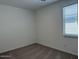Clean bedroom with neutral carpet and a window with blinds for natural light at 18240 W La Senda Dr, Surprise, AZ 85387