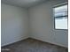 Bright bedroom with a window and neutral carpet, ready for your personal touch at 18240 W La Senda Dr, Surprise, AZ 85387