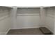 Walk-in closet with shelving and clothing racks at 18240 W La Senda Dr, Surprise, AZ 85387