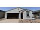 Charming single-story home with a neutral color palette and low maintenance landscaping at 18240 W La Senda Dr, Surprise, AZ 85387