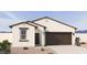 Charming single-story home showcasing a neutral color palette and low maintenance landscaping at 18240 W La Senda Dr, Surprise, AZ 85387