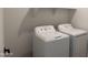 Functional laundry room featuring a modern washer and dryer, perfect for convenient chores at 18240 W La Senda Dr, Surprise, AZ 85387
