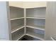 Pantry with multiple shelves for ample storage and organization at 18240 W La Senda Dr, Surprise, AZ 85387