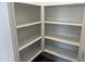 Walk-in pantry with white shelving for organized storage at 18240 W La Senda Dr, Surprise, AZ 85387