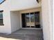 Covered patio area with sliding glass doors at 18240 W La Senda Dr, Surprise, AZ 85387