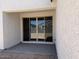 Covered patio featuring large sliding doors providing seamless indoor/outdoor living at 18240 W La Senda Dr, Surprise, AZ 85387