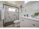 Contemporary bathroom features a sleek shower, modern vanity, and stylish fixtures, enhanced by new floors at 1917 W Ashland Ave, Phoenix, AZ 85009
