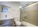Stylish bathroom with modern vanity, glass enclosed shower, and new fixtures at 1917 W Ashland Ave, Phoenix, AZ 85009