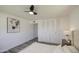 Bright bedroom featuring a horse art piece and closet with modern doors at 1917 W Ashland Ave, Phoenix, AZ 85009