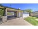 This carport shows ample space and leads to the backyard gate at 1917 W Ashland Ave, Phoenix, AZ 85009