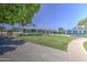 Inviting single-story home with a spacious lawn, providing a welcoming entrance and ample outdoor space at 1917 W Ashland Ave, Phoenix, AZ 85009