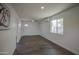 Inviting living room with hard surface flooring, white walls, and ample natural light at 1917 W Ashland Ave, Phoenix, AZ 85009