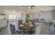 Open-concept living space with a dining area, kitchen, and comfortable seating, perfect for entertaining at 1917 W Ashland Ave, Phoenix, AZ 85009