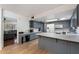 Spacious kitchen with stainless steel appliances, custom cabinets, and an open layout at 255 N Hunt E Dr, Mesa, AZ 85203