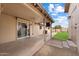View of the covered patio featuring a ceiling fan, sliding doors, and a view to the yard at 255 N Hunt E Dr, Mesa, AZ 85203