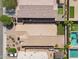 Aerial view of the home showcasing a roof, patio, pool, and yard at 2759 E Mews Rd, Gilbert, AZ 85298