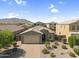 Aerial view of the home showing the landscaped front yard and mountain views at 2759 E Mews Rd, Gilbert, AZ 85298