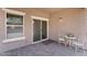 Back patio with brick pavers, sliding door, and a white patio set at 2759 E Mews Rd, Gilbert, AZ 85298