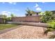 Backyard featuring a patio with brick pavers and artificial grass at 2759 E Mews Rd, Gilbert, AZ 85298