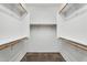 Spacious walk-in closet with built-in shelving and rods for organized storage at 2759 E Mews Rd, Gilbert, AZ 85298