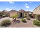 Charming single-story home features desert landscaping, a two-car garage, and a welcoming entrance at 2759 E Mews Rd, Gilbert, AZ 85298