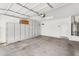 Spacious garage featuring built-in white cabinets and a water heater at 2759 E Mews Rd, Gilbert, AZ 85298