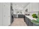 Spacious kitchen with stainless steel appliances, gray and white cabinets, and white countertops at 2759 E Mews Rd, Gilbert, AZ 85298