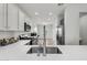 Modern kitchen featuring white countertops, stainless steel appliances, and gray/white cabinetry at 2759 E Mews Rd, Gilbert, AZ 85298