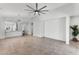 Spacious living room featuring tile floors, open layout, and a modern ceiling fan at 2759 E Mews Rd, Gilbert, AZ 85298
