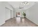 Bright living room with tile flooring, modern lighting, and sliding glass door to a patio at 2759 E Mews Rd, Gilbert, AZ 85298