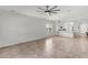 Expansive living area with tile flooring, neutral walls, and view into the kitchen at 2759 E Mews Rd, Gilbert, AZ 85298