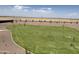 A well-manicured green backyard space that provides an outdoor enjoyment at 3033 E Mecklenburg Way, San Tan Valley, AZ 85143