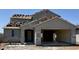 Home under construction with visible framing and initial exterior work at 3033 E Mecklenburg Way, San Tan Valley, AZ 85143