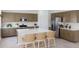 This kitchen features a large island, modern appliances, stylish cabinets, and tile flooring at 3033 E Mecklenburg Way, San Tan Valley, AZ 85143