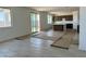 Open-concept living room and kitchen area with modern flooring and lots of natural light at 3033 E Mecklenburg Way, San Tan Valley, AZ 85143