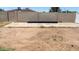 Spacious backyard featuring block fence and potential for outdoor activities at 3802 W Mulberry Dr, Phoenix, AZ 85019